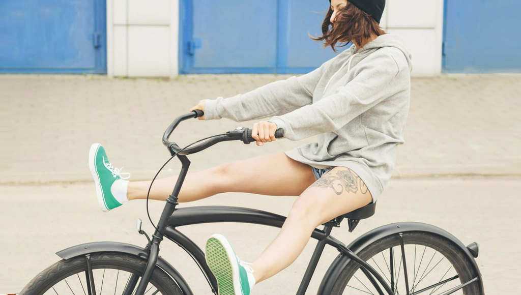young women riding bike